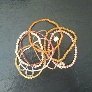 Bundle of beautiful beaded bracelets with charms